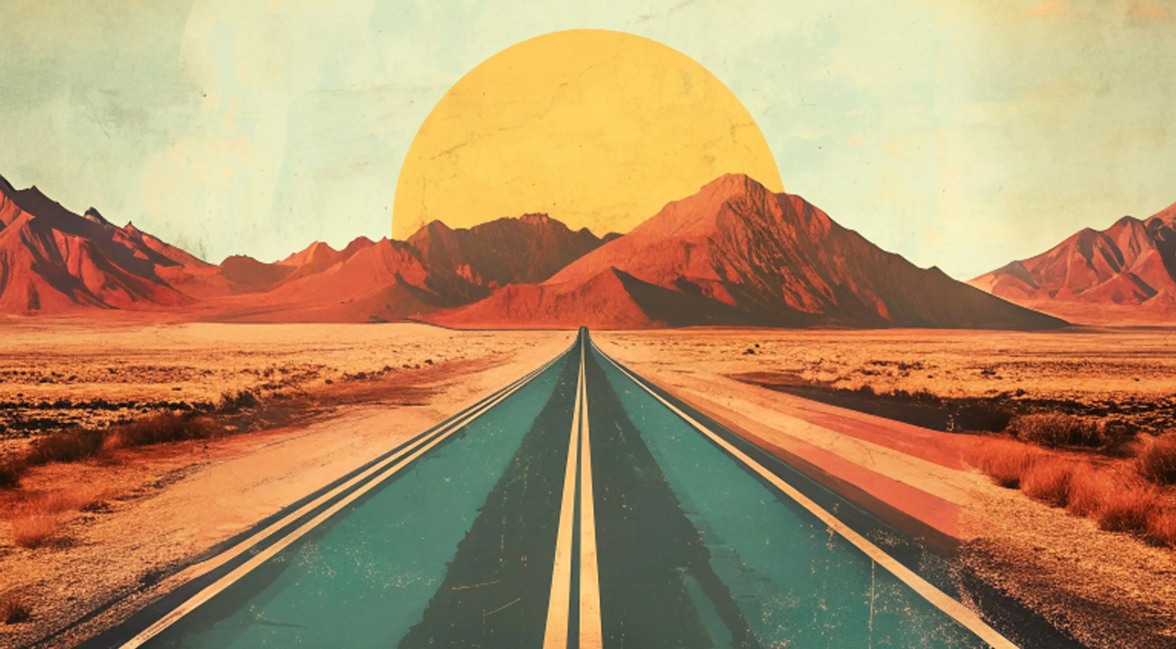 Road toward a low sun between mountains